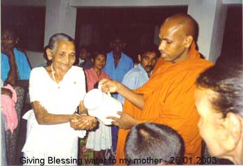 2003.01.20 Giving Blessing water to my mother at temple - Rajangana track 11