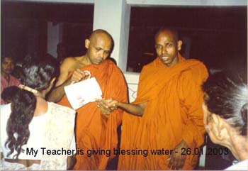 2003.01.20 My teacher is giving Blessing water at temple - Rajangana track 11.