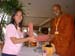 International Vesak day in Thiland 2006 - offering a gift
