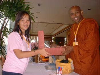 International Vesak day in Thiland 2006 - offering a gift